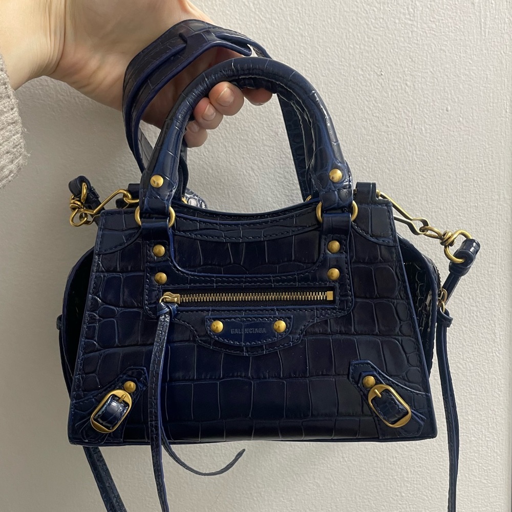 Balenciaga navy blue crocodile embossed neo classic bag. Retails for $2550.